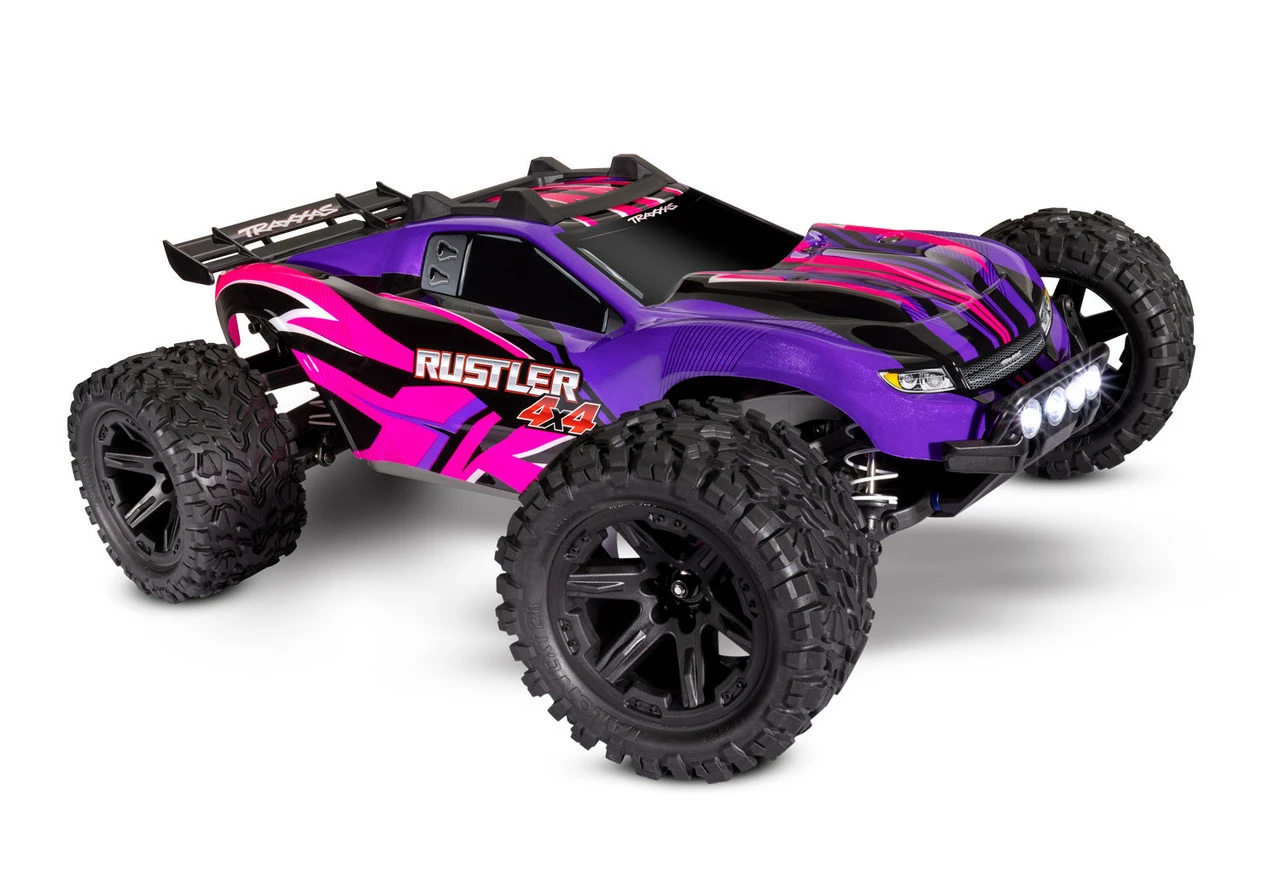 Traxxas Rustler 4X4 Brushed RTR 1/10 4WD Stadium Truck W/TQ 2.4GHz Radio & ID Battery & DC Charger, LED Lighting, Pink 3 Traxxas Rustler 4X4 Brushed RTR 1/10 4WD Stadium Truck W/TQ 2.4GHz Radio & ID Battery & DC Charger, LED Lighting, Pink